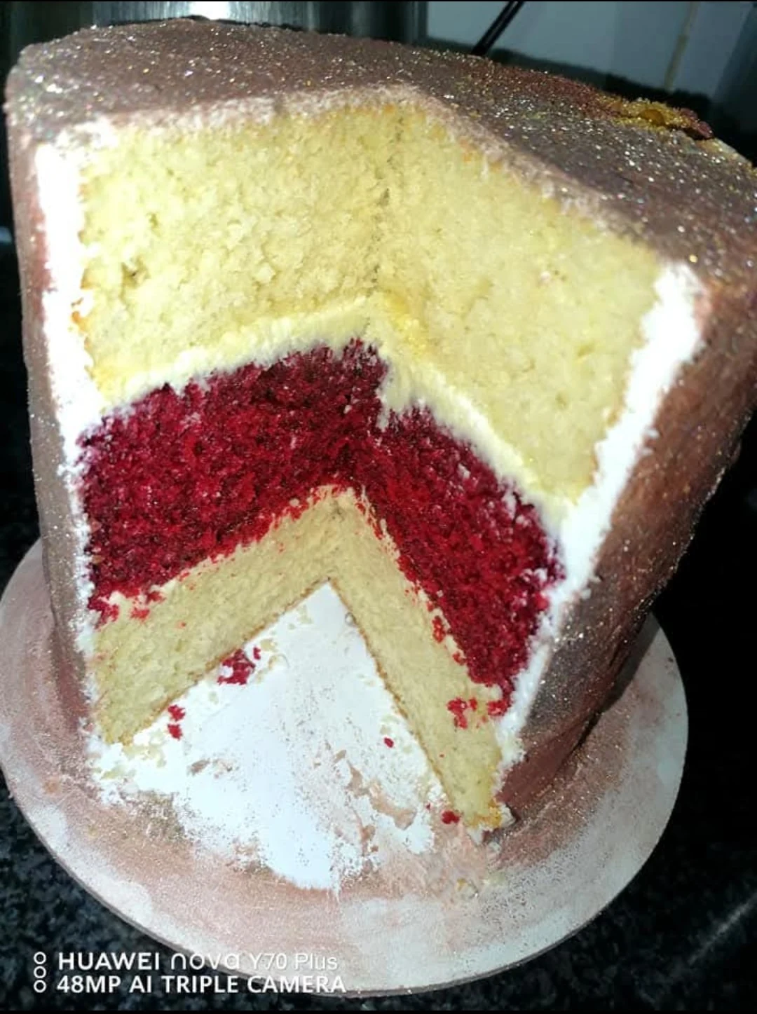 Red velvet and vanilla layered cake slice